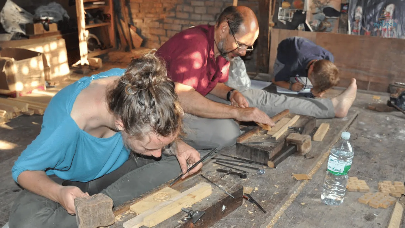An expert student at the carving workshop